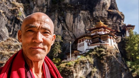 Monk in front of the Tiger's Nest Monastery